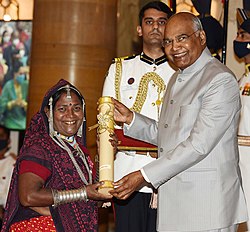 Bhuri Bai, pioneering female Bhil artist, receiving Padma Shri Award